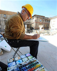 Artistas desenham pinturas narrando as marcas do terremoto de L'Aquila, ocorrido há 18 meses
